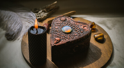 Magical attribute on a table, witchcraft concept, Candle fire, Spells and other rite
