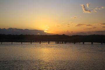 Sunset at Back creek bridge South west rocks,Australia /Beautiful sunset  and sky clouds at the Back creek Bridge, South west rocks, Australia/ Reflective sunset at Back creek bridge South west rocks,
