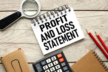 Business concept. profit and loss statement. text on white paper page near calculator on office desk