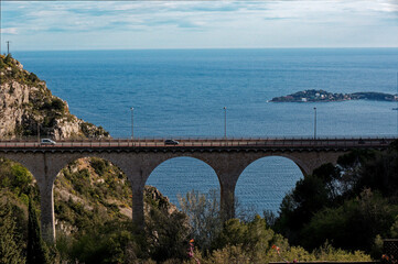 Stone bridge near Eze village with Mediterranean sea in the background