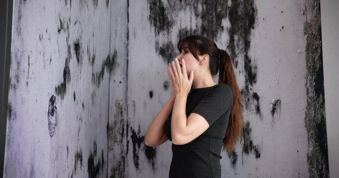 Mold Damage On House Wall. Woman Looking