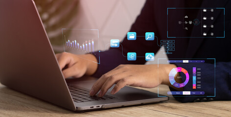 Business and Technology. Businessman using computer laptop to manage data with digital icons.