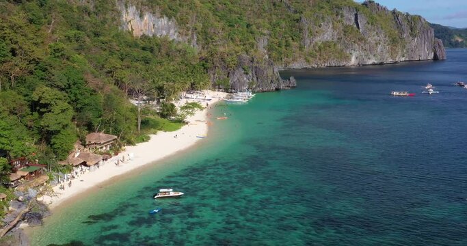Drone video of the paradisiacal Seven Commandos beach near El Nido on the Philippine island of Palawan