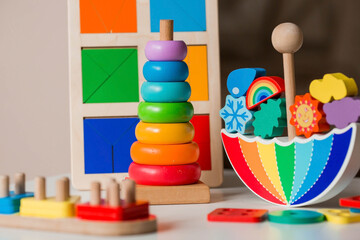 Balancer toys. Children's wooden toy in the form of an umbrella, color pyramid and educational...