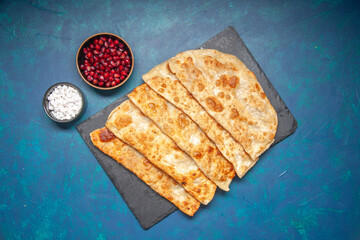 top view tasty gutabs thin hotcakes with meat on blue background pastry bake oven pie cake food meal hotcake color