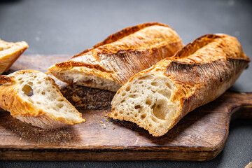 baguette long fresh bread whole wheat flour sourdough meal food snack on the table copy space food background rustic top view
