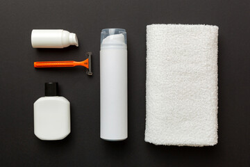 shaving man set. shaving machine, towel, lotion and shaving foam on colored background. Men bath Accessories top view