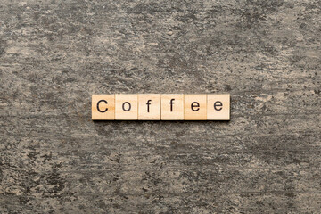 coffee word written on wood block. coffee text on table, concept