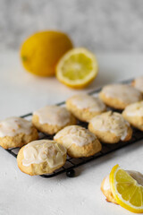 Homemade Italian lemon shortbread cookies with glaze and almond. Shortbread citrus biscuits on white stone background