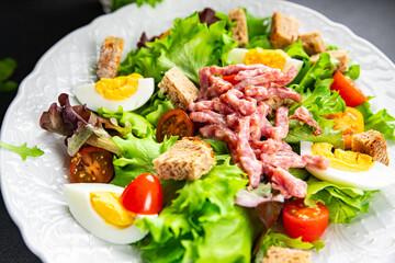 meat salad, bacon, egg, crouton, lettuce, salad dressing vinaigrette  Vosges salad Lorraine cuisine  meal food snack on the table copy space food background rustic top view
