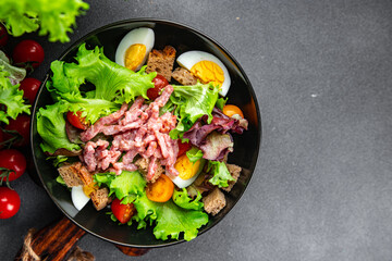 meat salad, bacon, egg, crouton, lettuce, salad dressing vinaigrette  Vosges salad Lorraine cuisine  meal food snack on the table copy space food background rustic top view