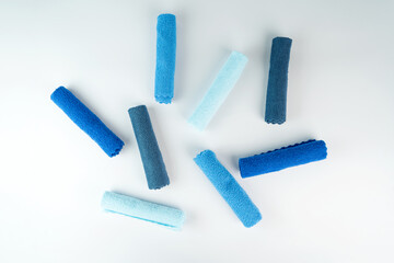 Colorful microfiber towels on a white table. Cleaning and housekeeping concept