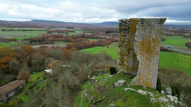 Sandi&aacute;s tower in ourense, spain, historic monument on hillside, cloudy day