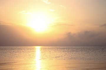 beautiful sunrise over the sea with sunbeams through the clouds
