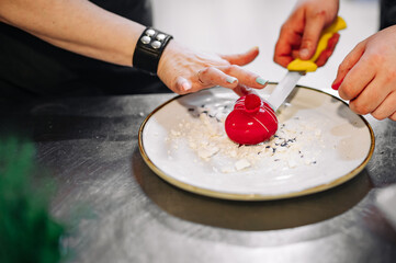 Obraz na płótnie Canvas Chef cooking Dessert cake with fruit on restaurant kitchen