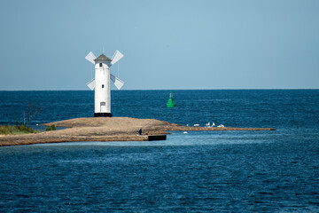Panoramic image of an old lighthouse in Swinoujscie, a port in Poland on the Baltic Sea.