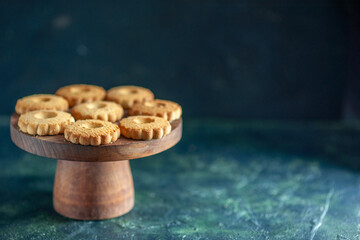 front view sweet cookies on the dark background biscuit sugar cake pie sweet dessert break dough tea