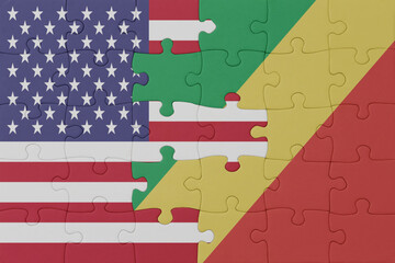 puzzle with the national flag of republic of the congo and united states of america.macro