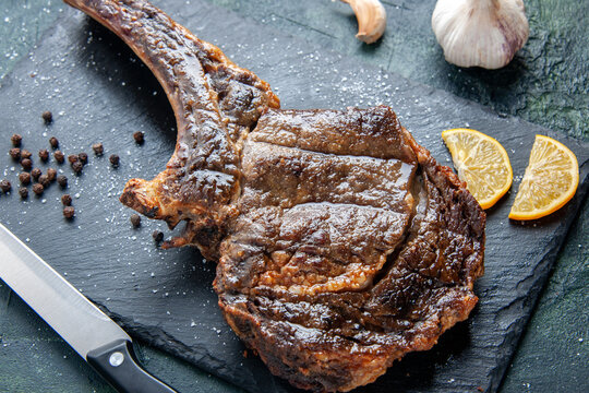 top close view fried meat slice with lemon slices on dark background meat dinner food dish fry color animal rib cooking