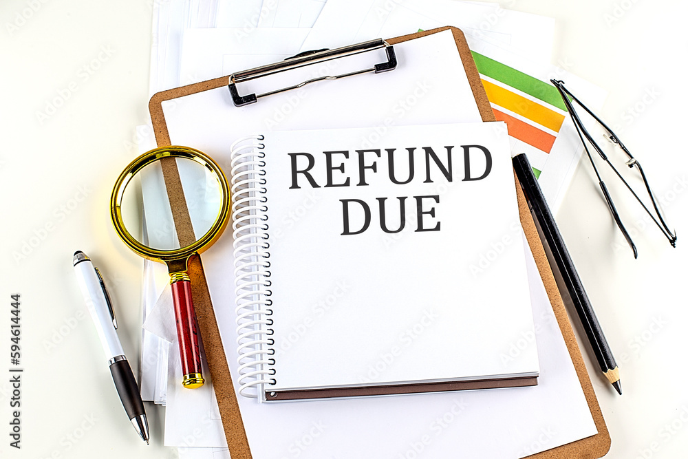 Poster refund due text on notebook with clipboard on white background