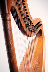 A Symphony of Strings: Elegant Close-up of a Wooden Harp - Embracing the Beauty, Timelessness, and Craftsmanship of this Enchanting Instrument. Generative AI