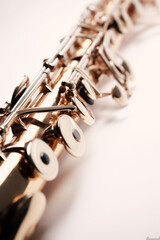 Obraz premium A Symphony in Brass: Captivating Close-up of a Gleaming Clarinet - Celebrating the Craftsmanship and Beauty of a Time-Honored Woodwind Instrument. Generative AI