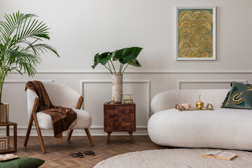 Elegant composition of living room interior with mock up poster frame, white sofa, beige armchair, vase with flowers, plants and personal accessories. Home decor. Template.