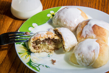 Pastries with meat topped with milk yogurt...Balkan dish known as "mantije"...