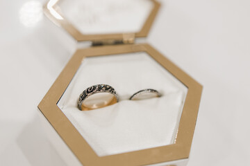a white wooden box for wedding rings on the table
