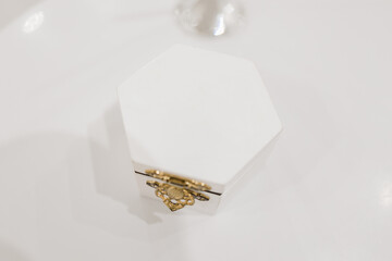 white wooden box for wedding rings on the table