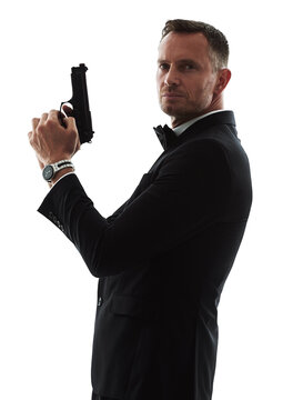 Suit, gun and man in portrait isolated on transparent, png background for secret agent business, action movie or crime. Detective, investigation and professional person or bodyguard with firearm