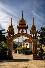 Fototapeta na wymiar Gate leading to the Ban Yon Temple in Xieng Khuang during sunset