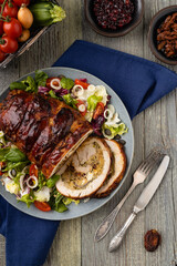 Stuffed turkey breast. Roasted whole, served with fresh vegetables.