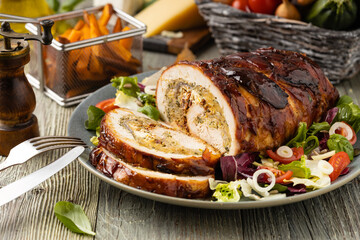 Stuffed turkey breast. Roasted whole, served with fresh vegetables.