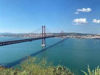 25 de Abril Bridge with Lisbon skyline in the background. Portugal.