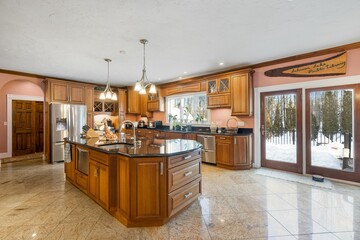 Kitchen with a countertop oven and a door leading to a backyard