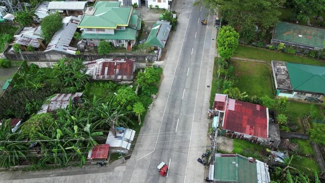 Aerial overview of southeast asia neighrborhood with filipino tricycles
