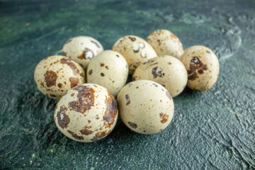front view quail eggs on a dark-blue background food chicken bird morning breakfast color - obrazy, fototapety, plakaty