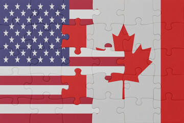 puzzle with the national flag of canada and united states of america. macro
