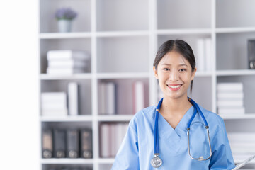 Medical concept of Asian beautiful female, doctor in blue coat with stethoscope, waist up. Medical...