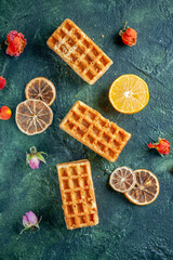 top view delicious little cakes on dark blue background pie cake biscuit color dessert tea cookie