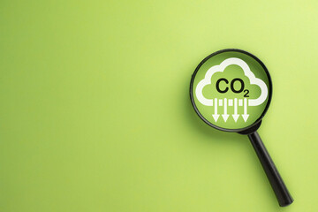 Reduce Co2,Carbon Reduction,Carbon dioxide emissions, carbon footprint concept.,Magnifying glass...