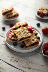 Homemade berry pastry squares on a white plate