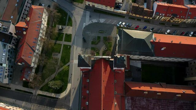Drone is flying high above Trnava St John the Baptist Cathedral, cityscape, 4k