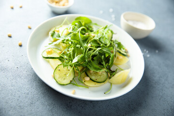 Potato salad with cucumber and arugula