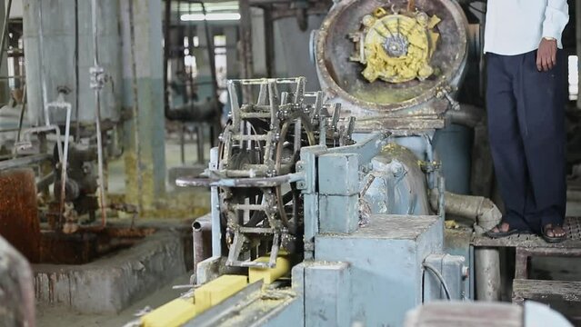 A view of soap noodles converted into soap bars by a plodder machine