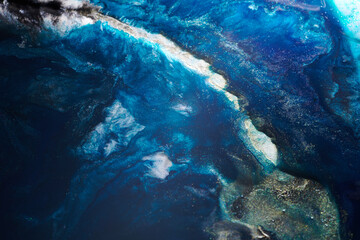 Obraz premium Luxury abstract background, liquid art. Blue alcohol ink with golden paint streaks, water surface, marble texture