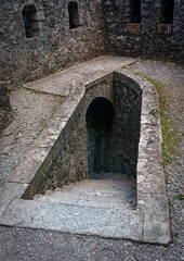 Stone staircase descending under the ramparts of Sisteron Citadel, France