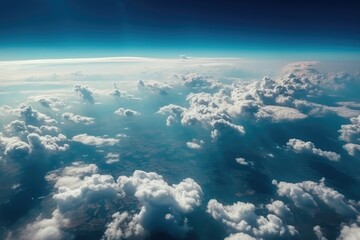 Naklejka na ściany i meble White clouds against the blue sky from the airplane. Generative AI.