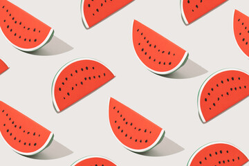 Summer pattern with slices of rubber watermelon on white background. Minimal summer fruit concept.